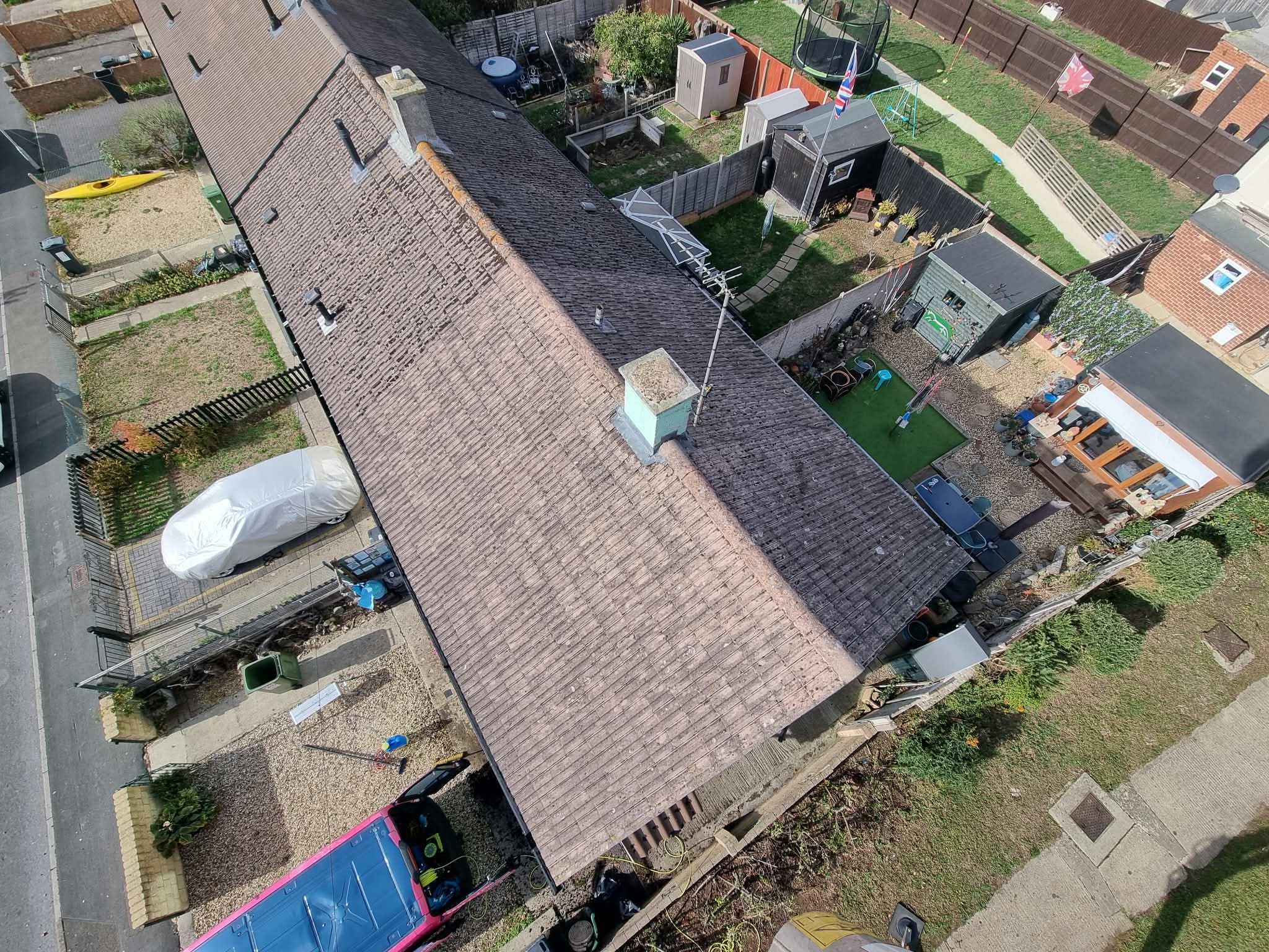 Aerial view of a clean, moss-free roof after cleaning