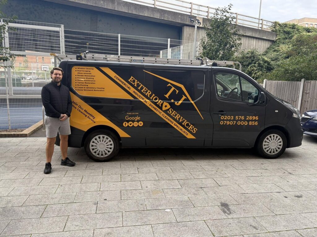Taylor from TJ Exterior Services standing in front of his van